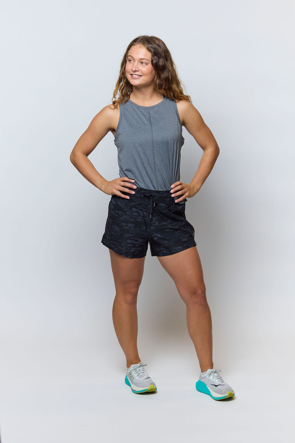 Gray Boxy Crop Tank, full-length front view with black camouflage shorts