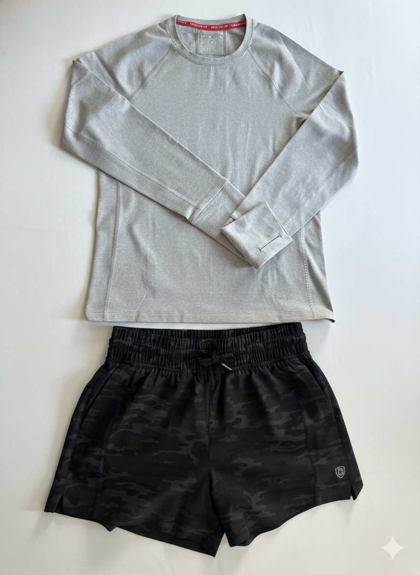 Gray Foudy 2.0 long-sleeve top laid flat with black camouflage shorts