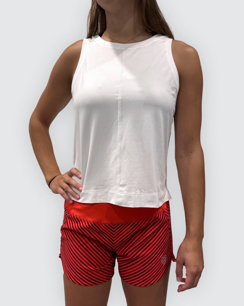 White Boxy Crop Tank, front view worn with red-and-black striped shorts