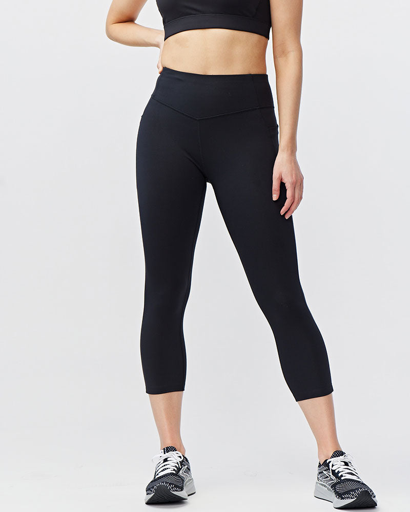 Black Go Again cropped leggings, front view showing the waistband and calf-length hems