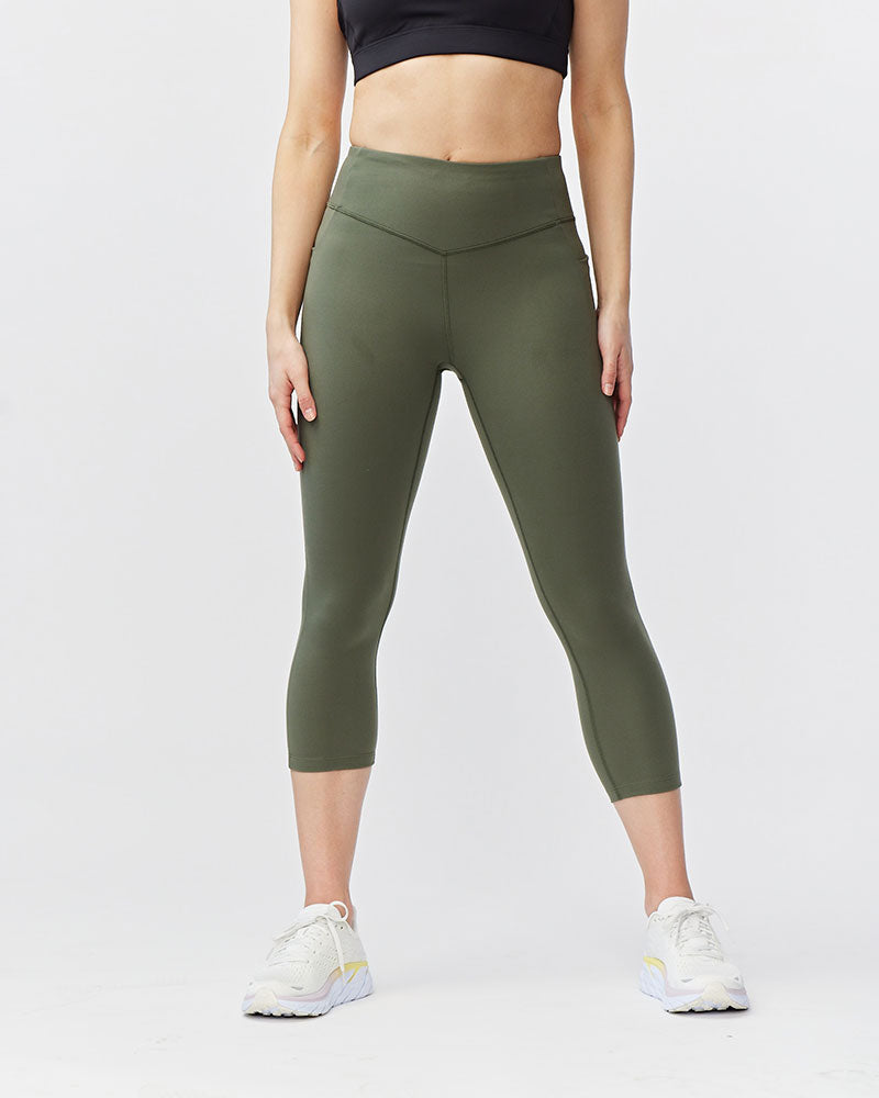 Olive green Go Again cropped leggings, front view showing the waistband and calf-length hems