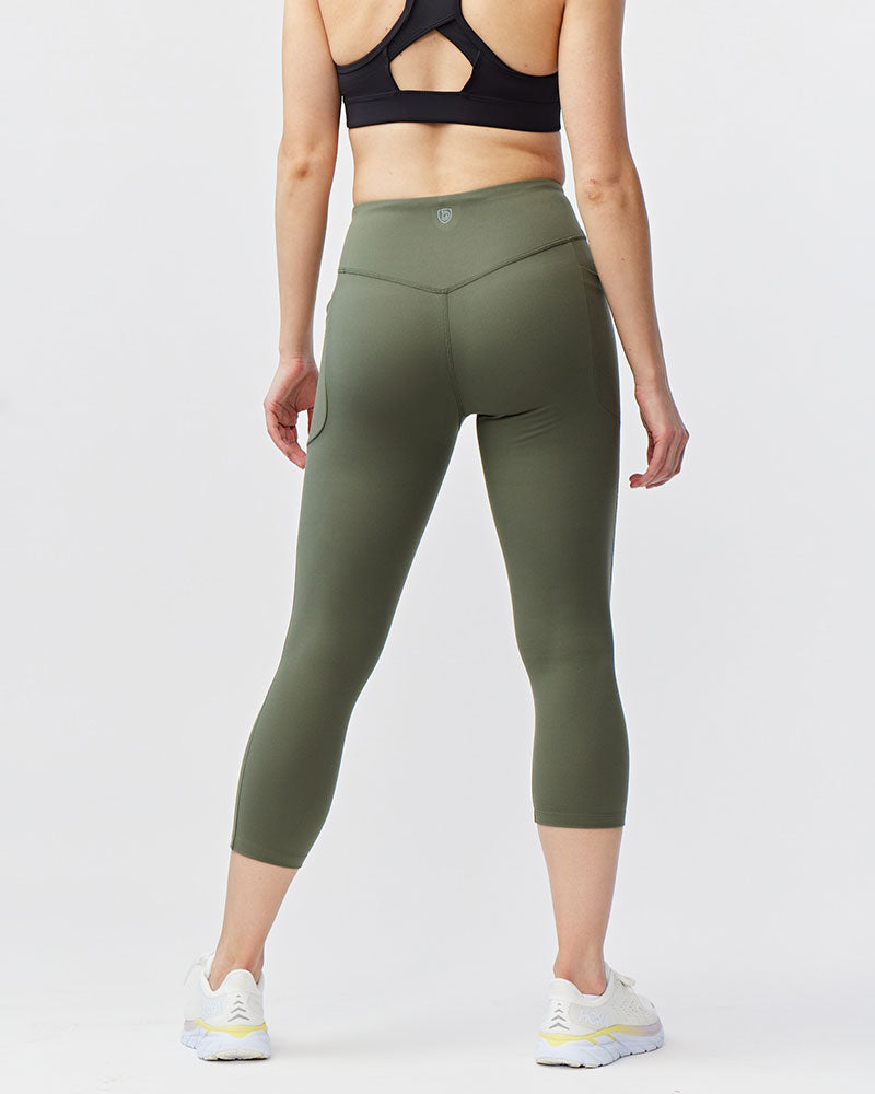 Olive green Go Again cropped leggings, back view showing the waistband and calf-length hems