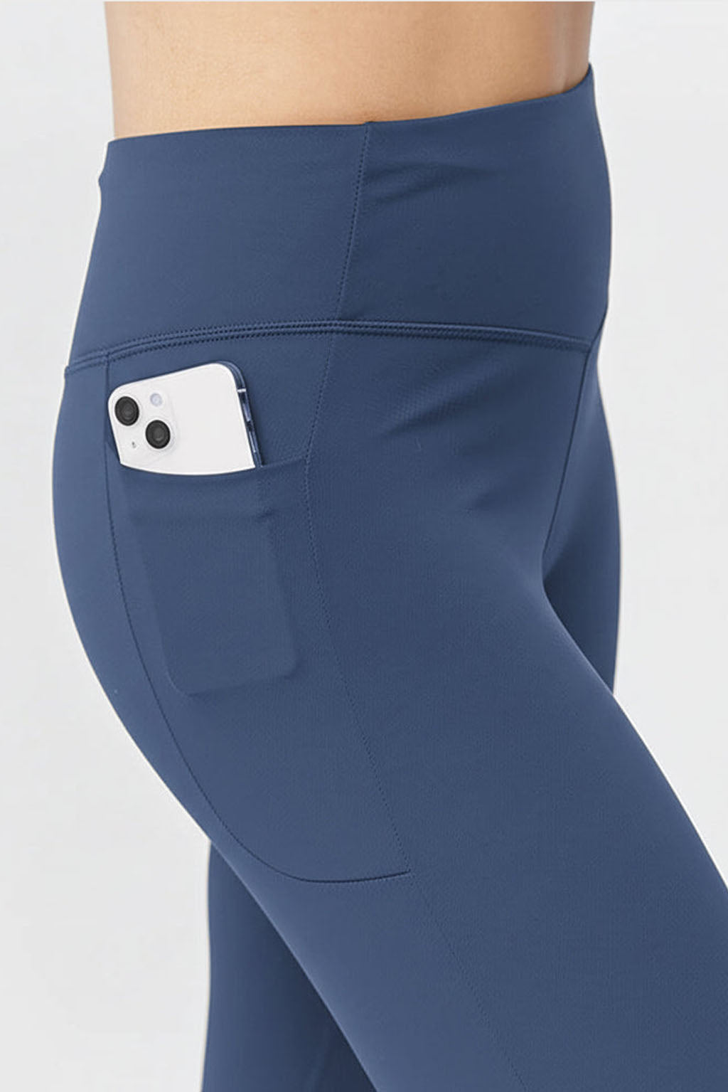 Blue Go Again cropped leggings, close-up of the side pocket holding a phone