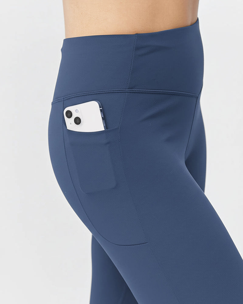 Blue Go Again cropped leggings, close-up of the side pocket holding a phone