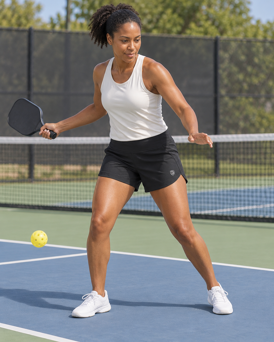 AI-assisted image of an adult woman forehand preparation wearing Excel Women's Workout Shorts in Black.